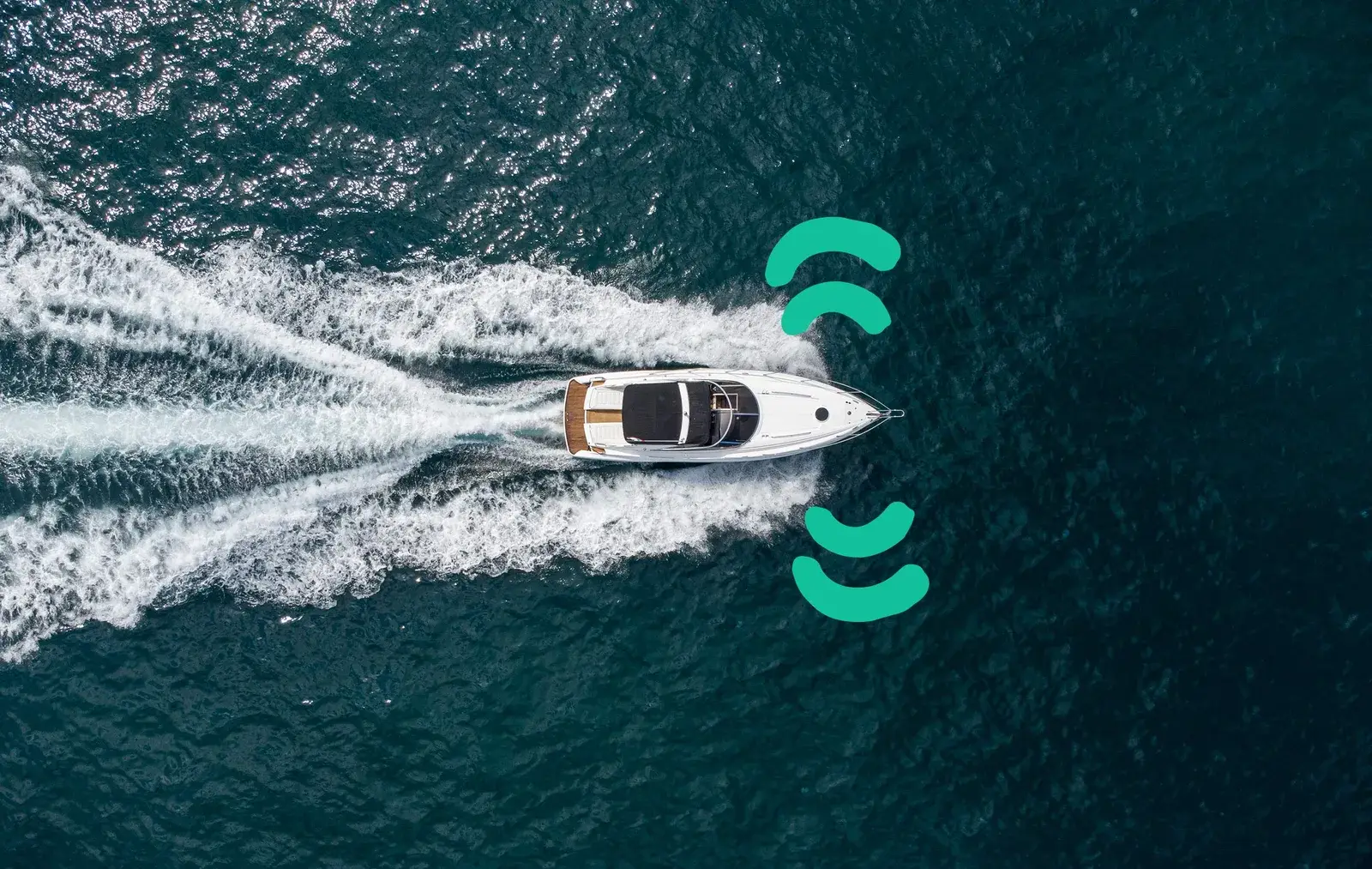 A motorboat seen from above with signal marks around it and a trail behind it