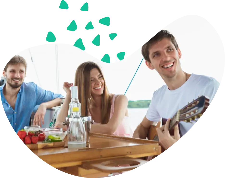 Three friends at a table on board, talking
