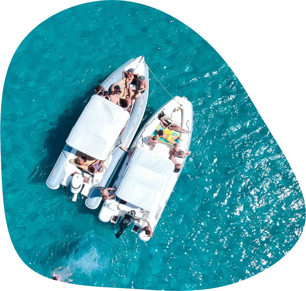 Two open boats moored side by side, seen from above
